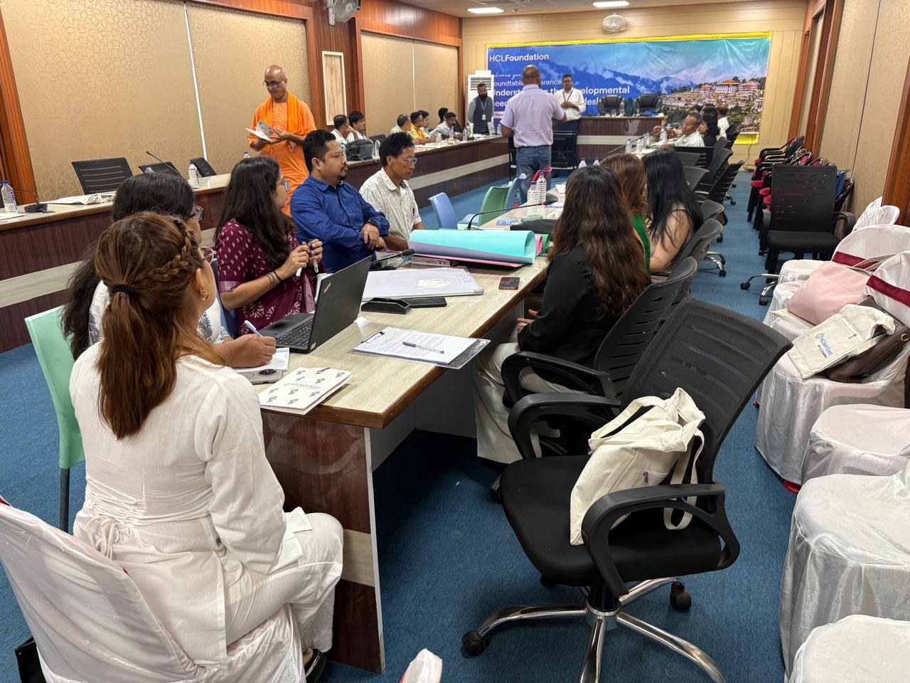 Participants taking part in a working session at the HCLFoundation roundtable conference
